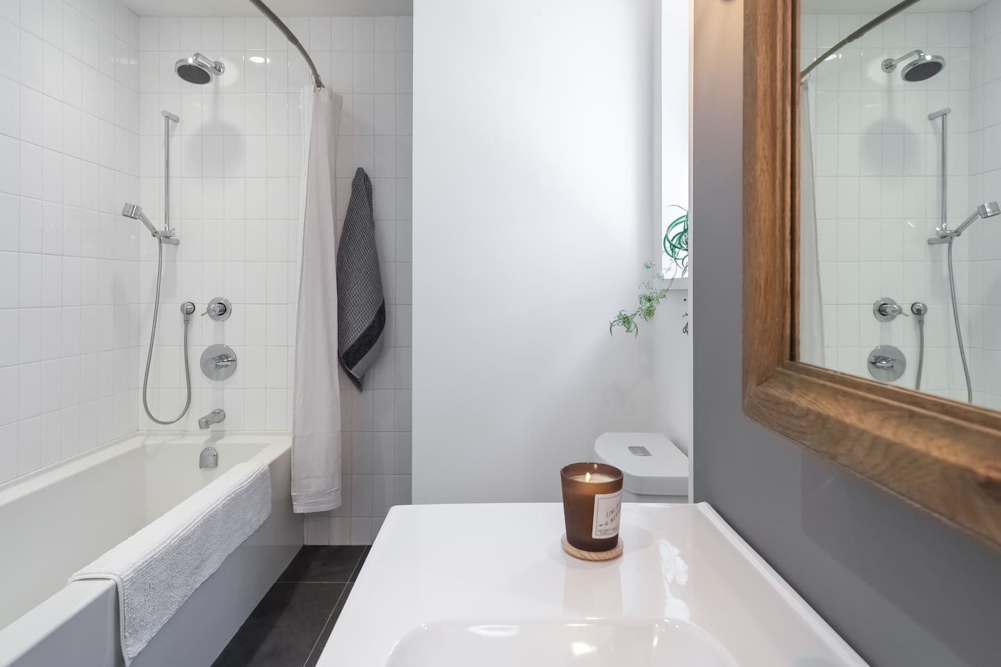 Bathtub with hand held and rain showers. Tub is extra long 72” soaker tub