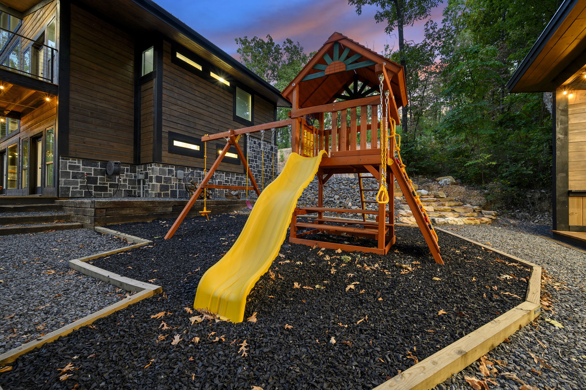 Family-friendly fun continues outside with a dedicated playground surrounded by peaceful Broken Bow scenery.