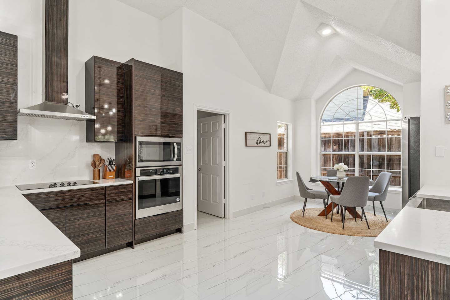 Enjoy preparing your meals in this gorgeous, fully-renovated kitchen that looks like it's out of an HGTV magazine! Plenty of cabinet space, new appliances, and ample natural lighting make this a haven for all of your meals!