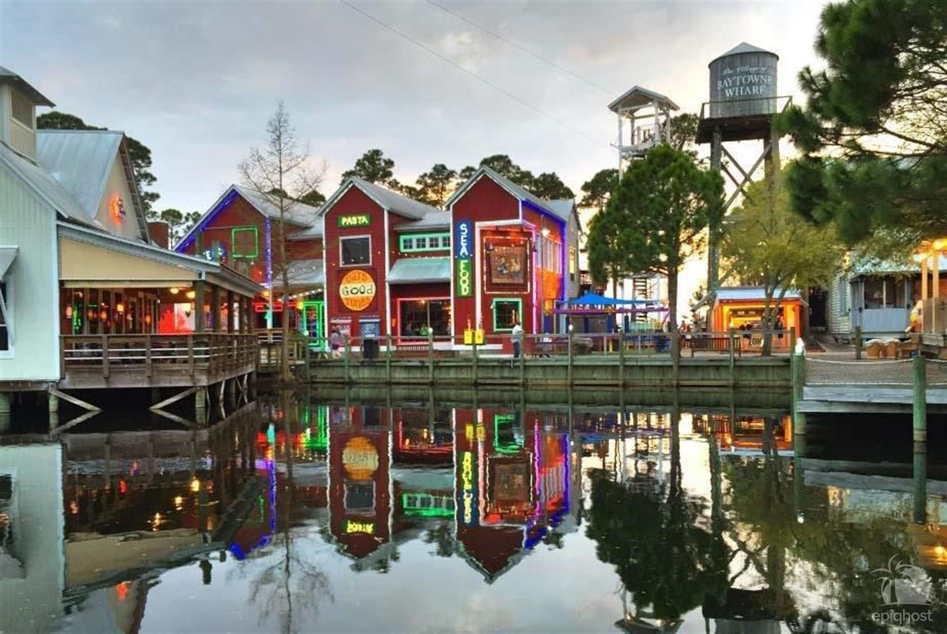 Colorful waterfront shops along the Baytowne Wharf lagoon