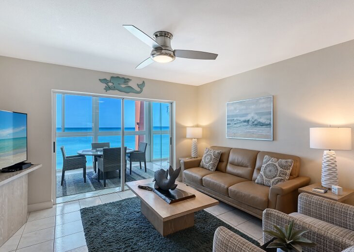 Living room with door to lanai for breeze & AC