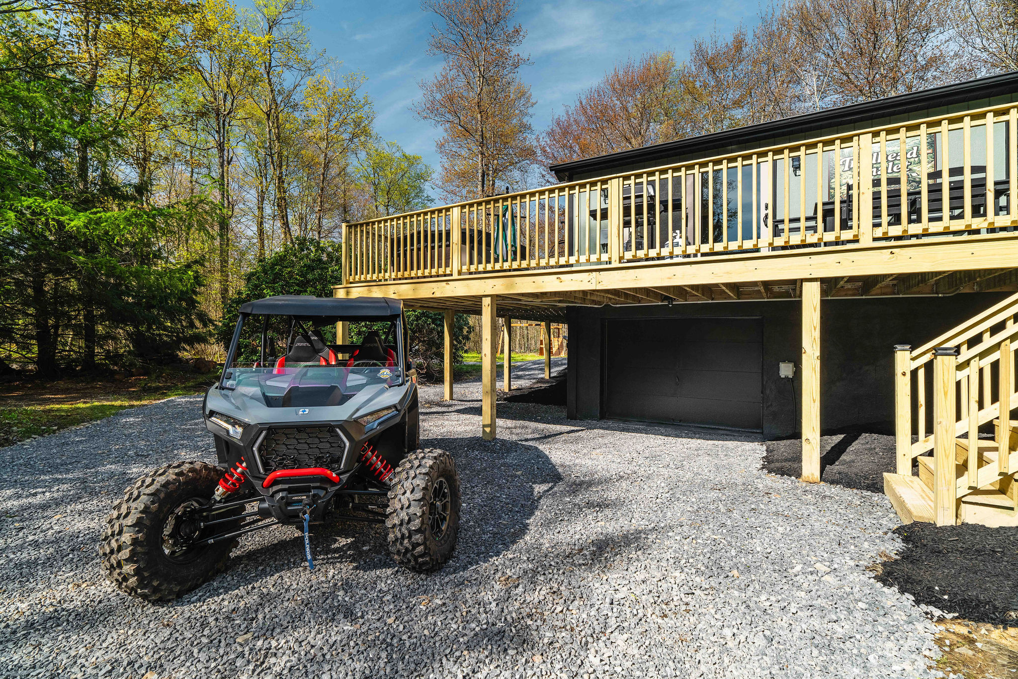 🛻 Pull-through gravel with room for toy haulers and trailers. *(UTV shown is not included — rent from our partners at Denton Go, 5 min away; rental info sent to every guest after booking.)*
