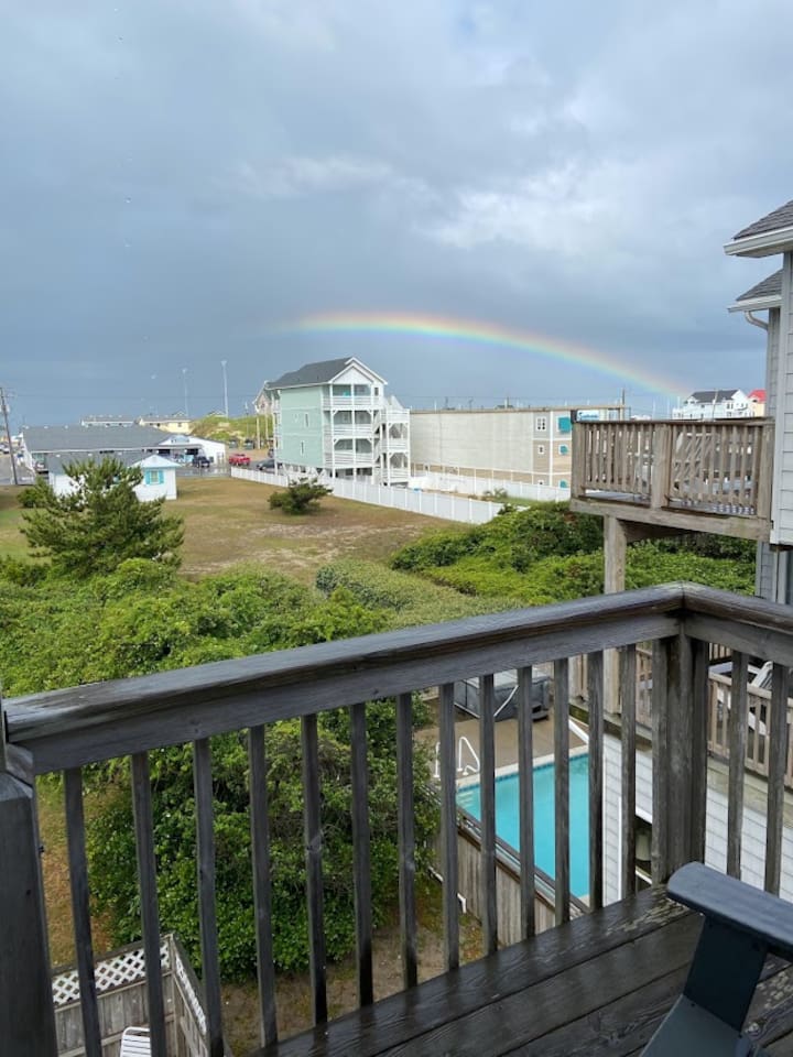 A rainbow right over the ocean and Jennette's Pier after a storm.