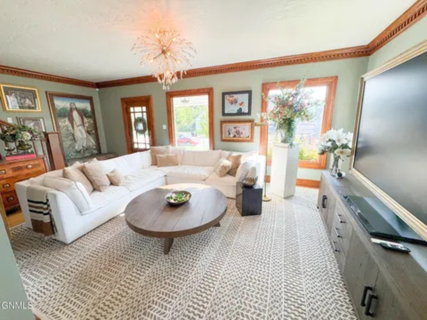 This spacious living room gives you a comfortable spot to stretch out, chat, or watch TV together.