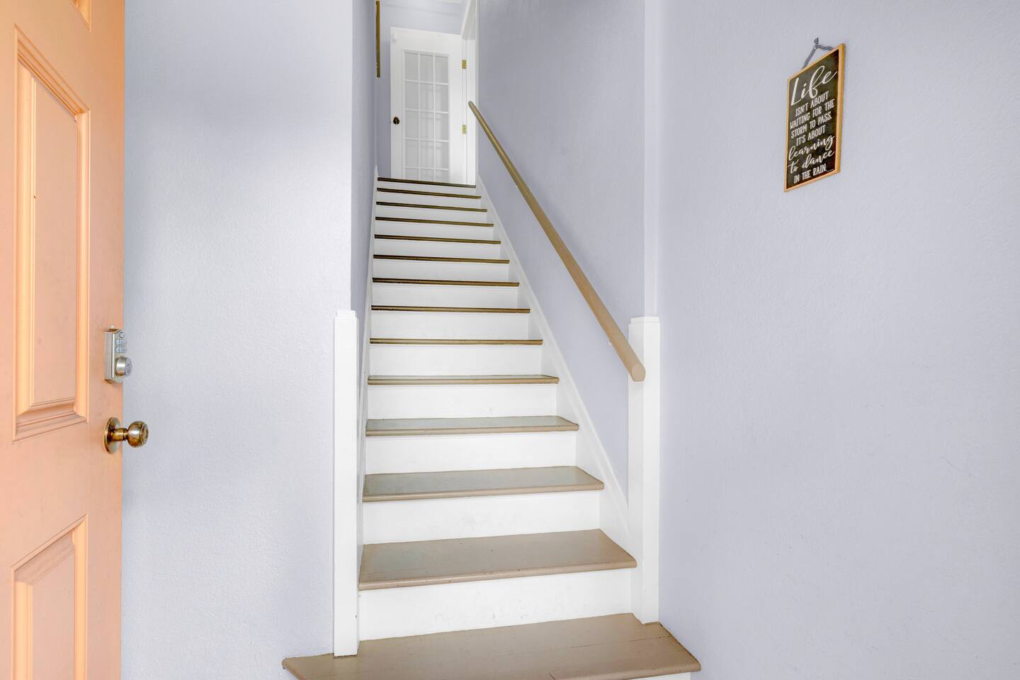 Private stairway from exterior ground entrance door to the upstairs home