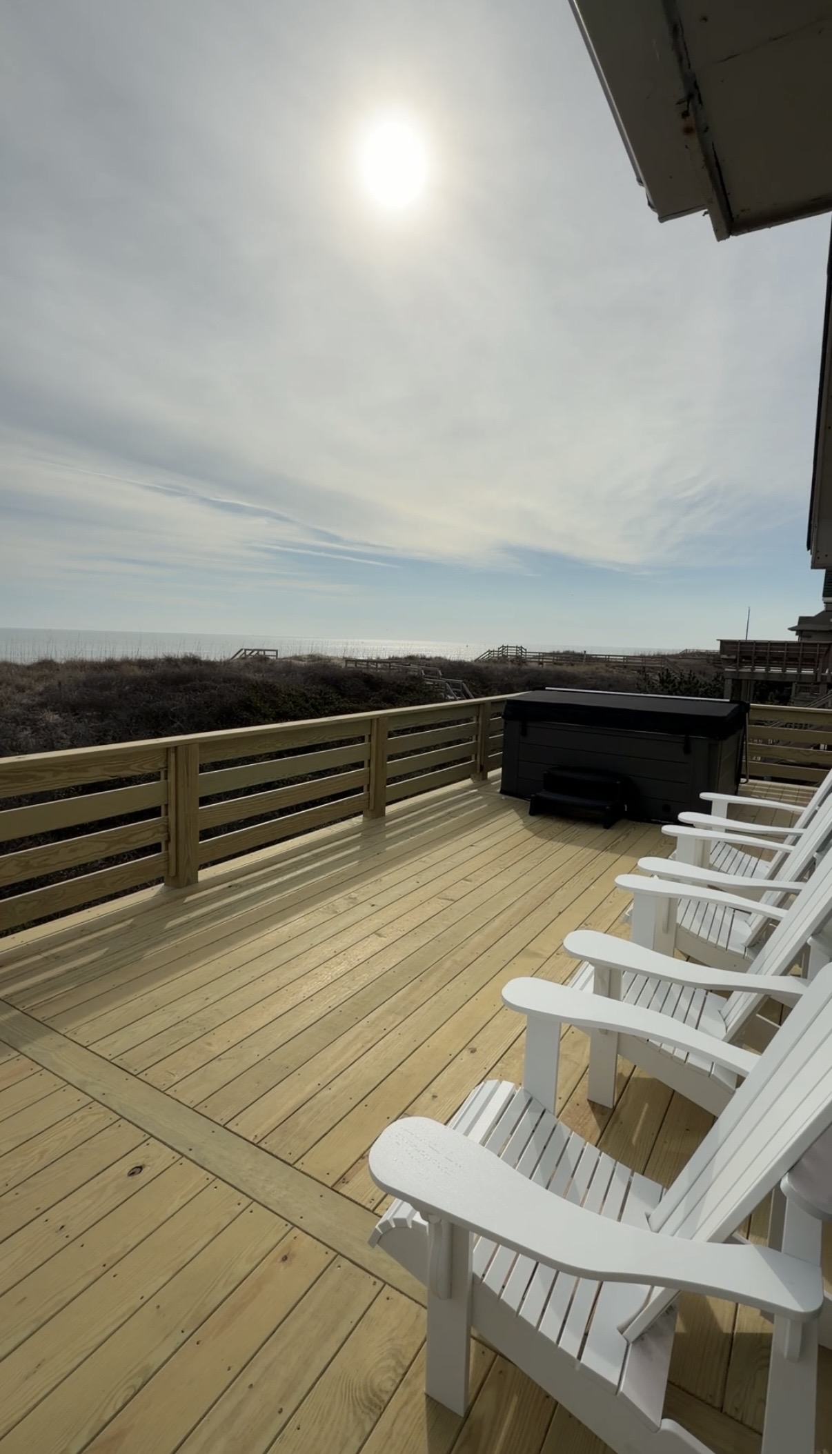 New deck with hot tub overlooking the ocean