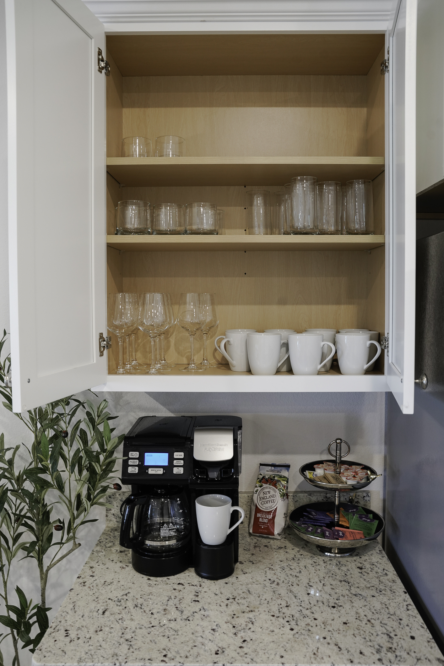 The coffee bar is stocked with tea, K-cups, and coffee grounds to get you started