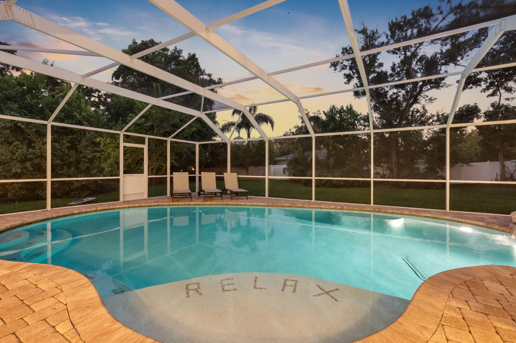Whether it’s a refreshing swim or a cozy soak, this pool and spa area delivers.