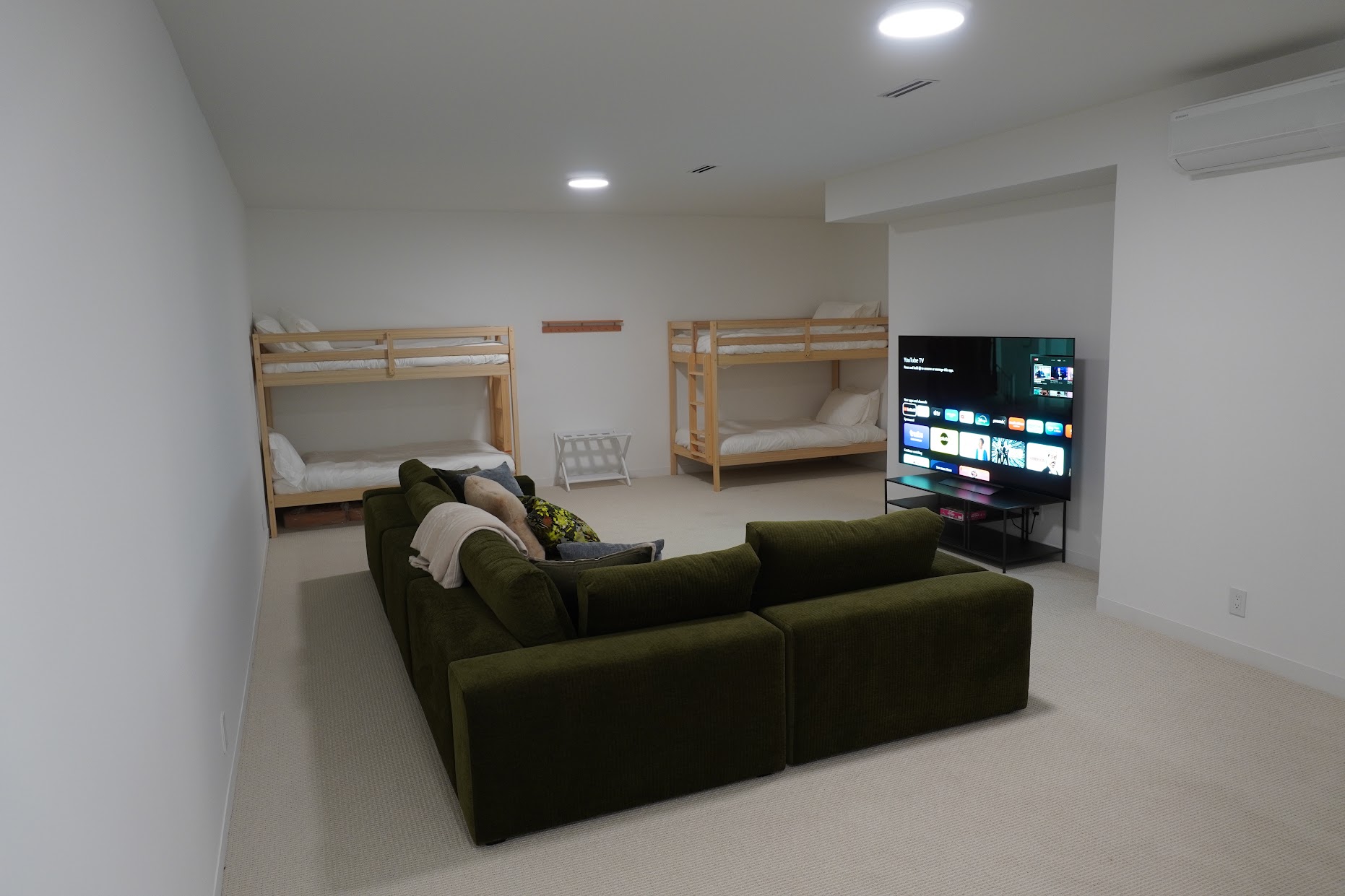 Two bunk beds make this basement a perfect kids hang.