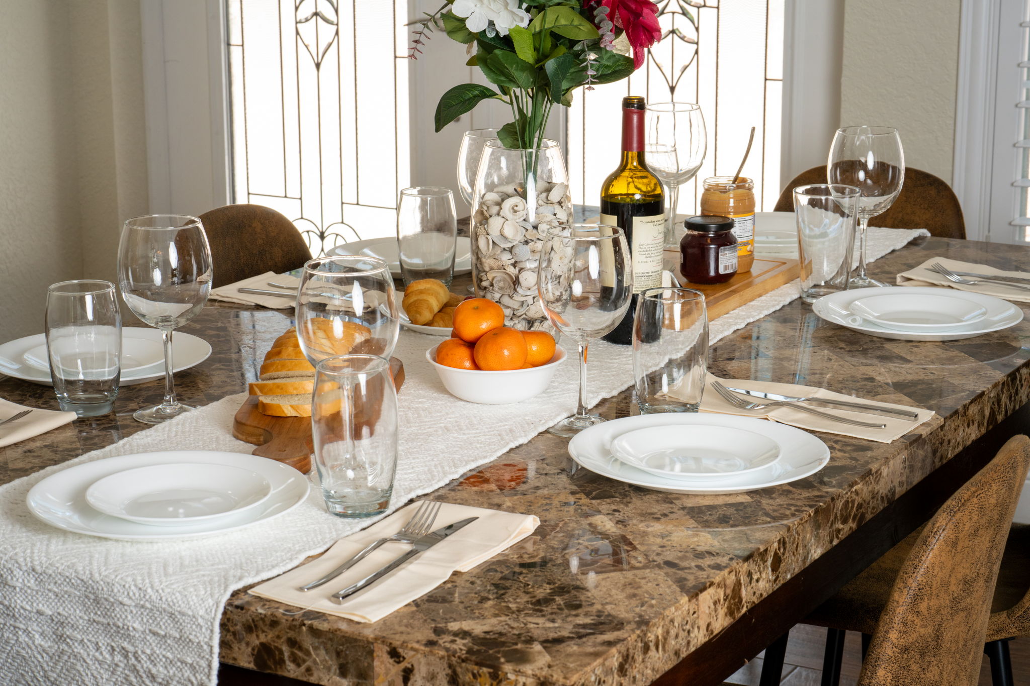 The marble-look tabletop and six comfortable chairs offer both style and practicality for everyday dining or special occasions.