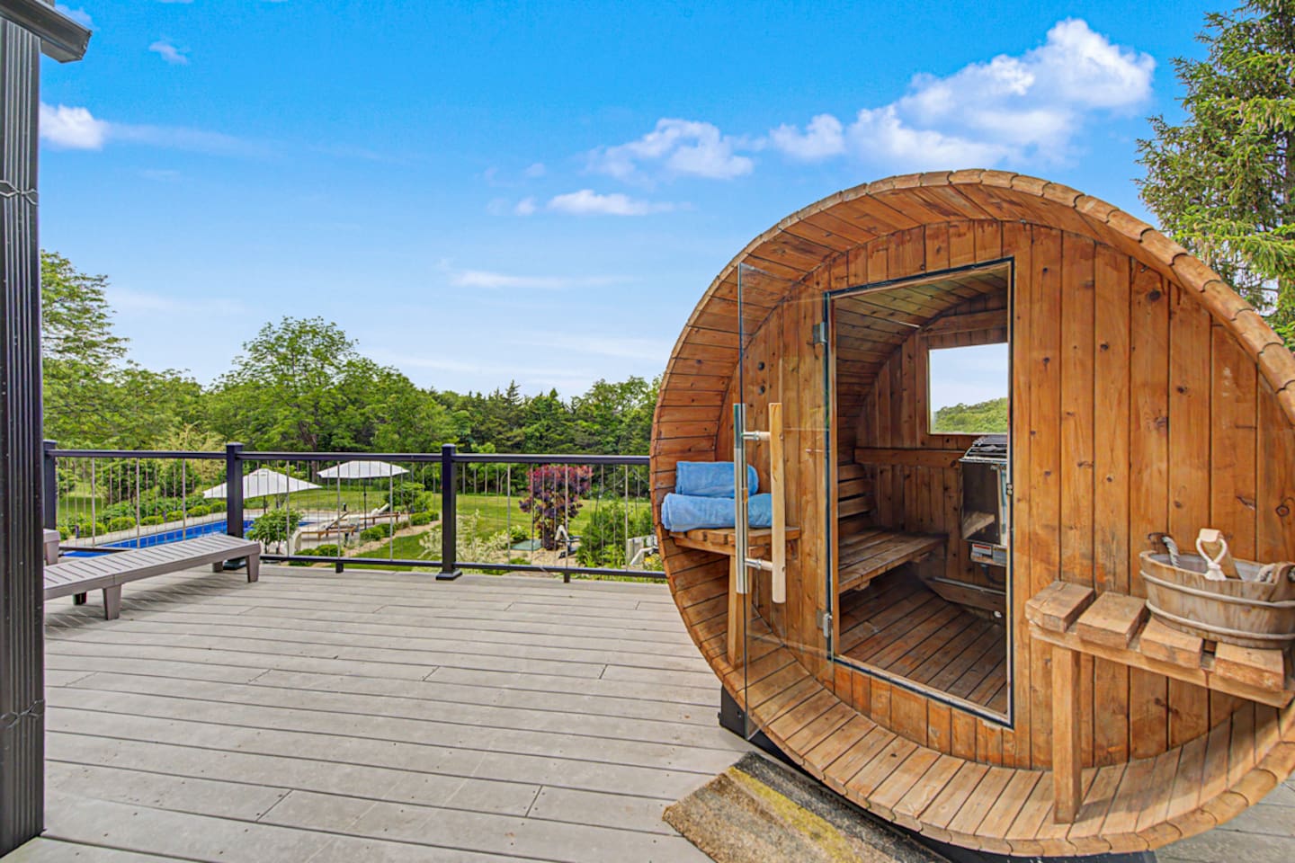 Cedar barrel sauna with the valley in front of you. Heat up, walk ten steps, drop into the pool.
