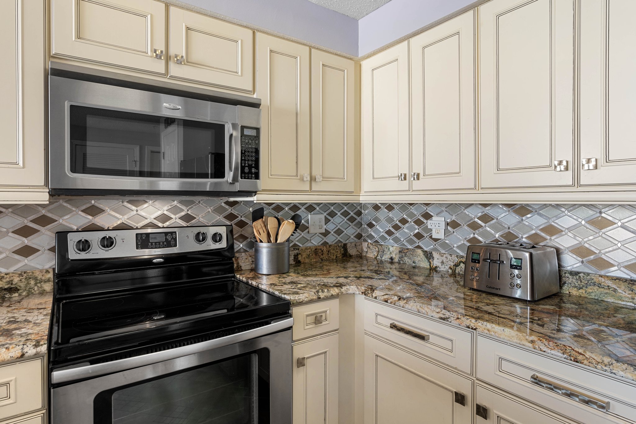 Additional kitchen view highlighting storage, workspace & open flow.