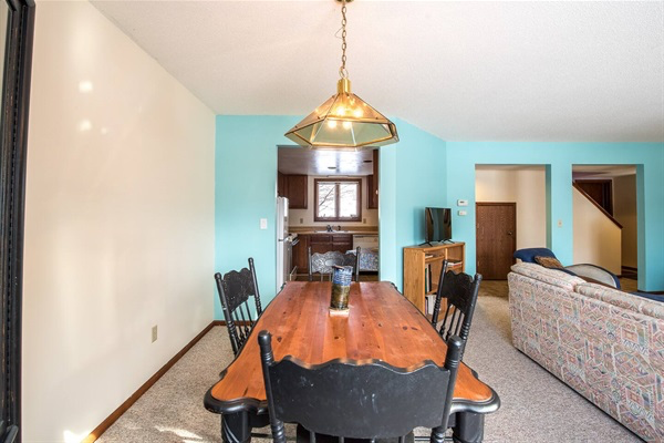 Shared dining room adjacent to kitchen and living room on the main level in the common spaces.