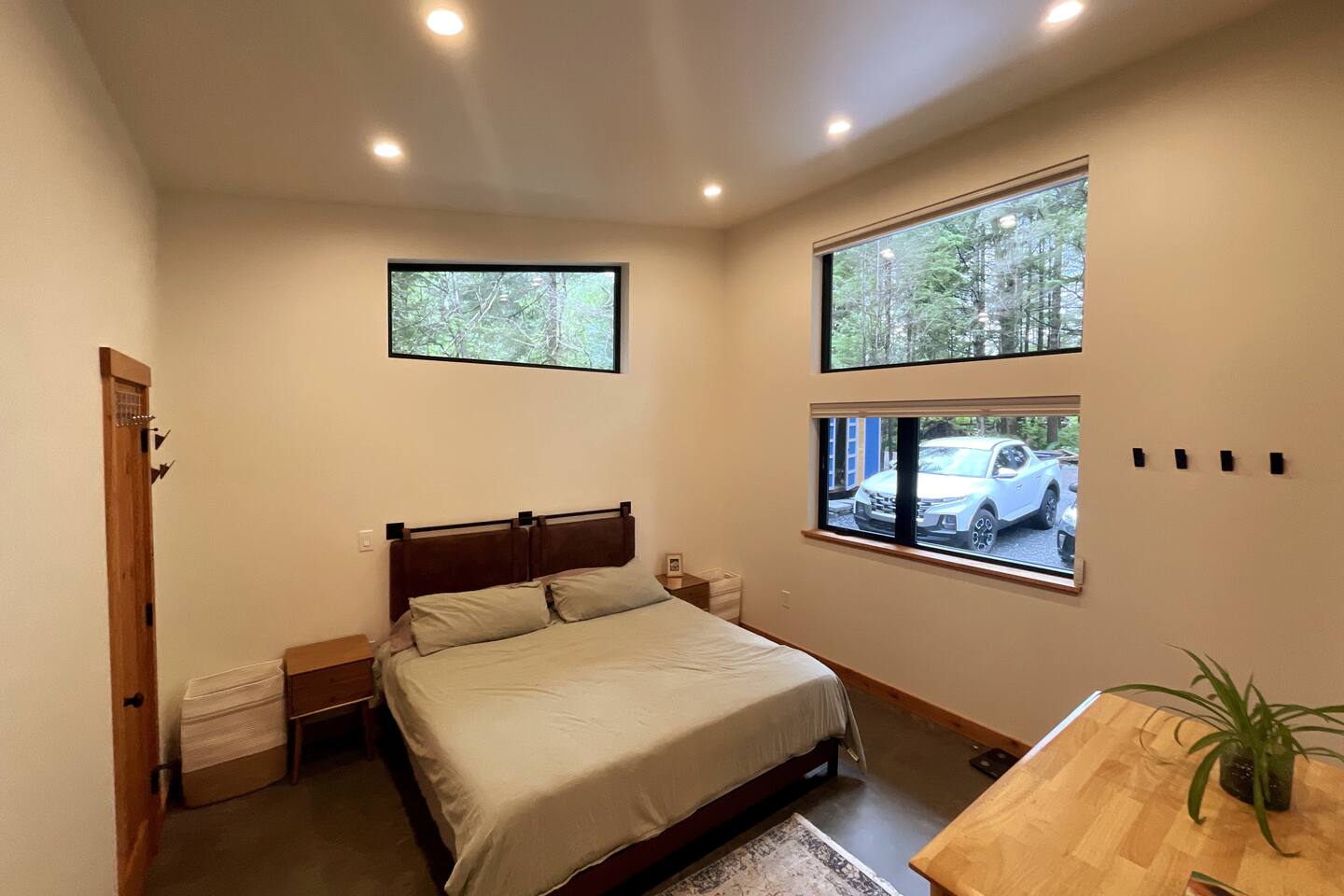 Master bedroom with king size bed and room darkening shades.