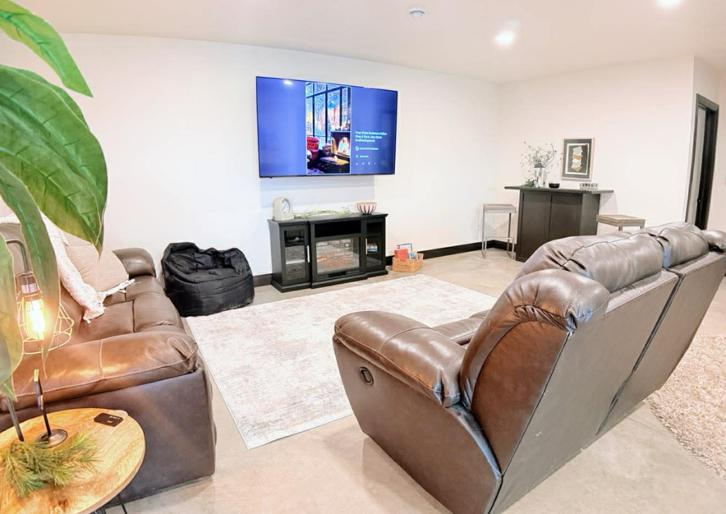 View of living room with additional high top seating at a table.
