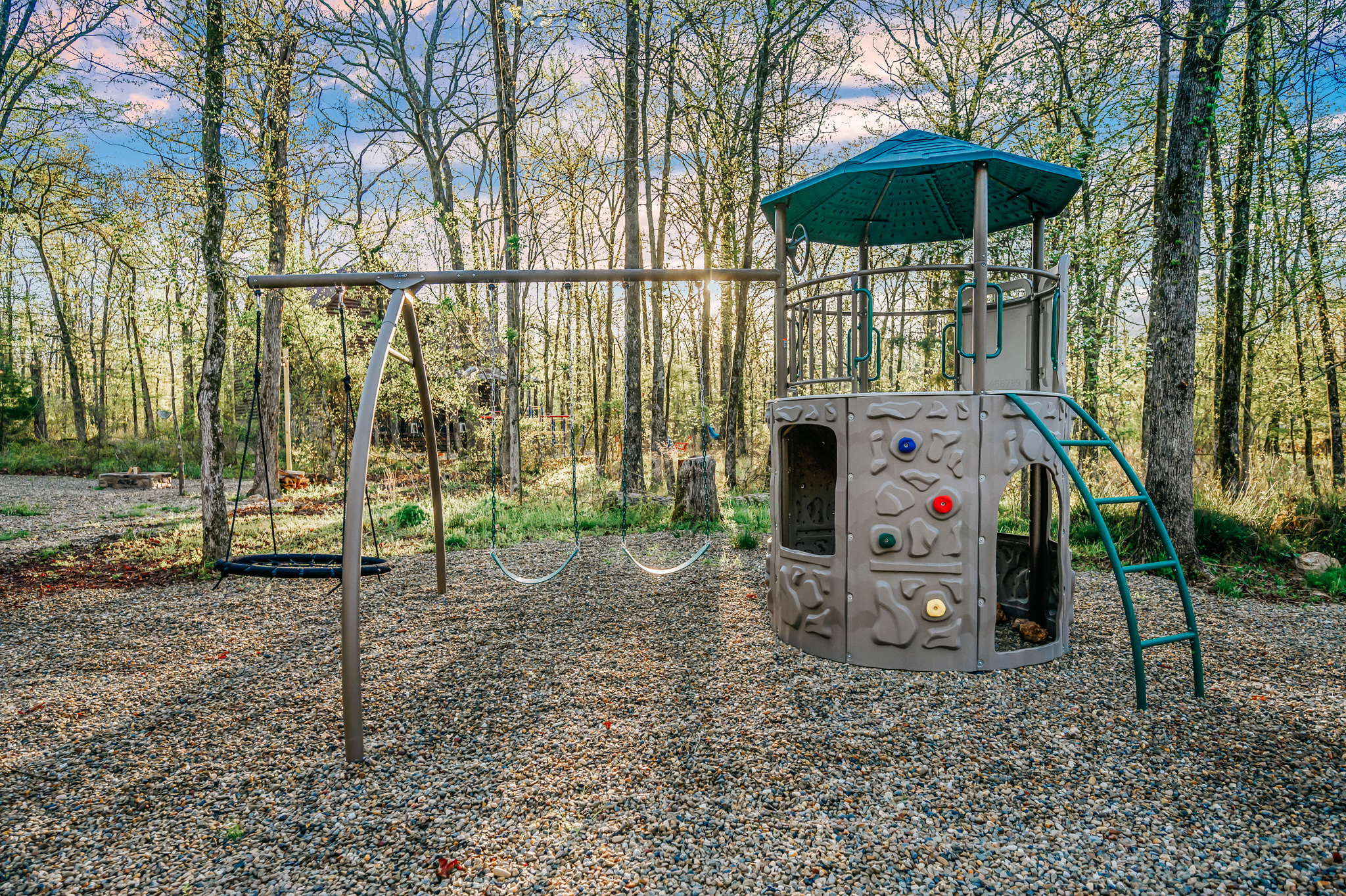 Kids can have their precious moments at the outdoor playground with a swing set, and a tower that they can climb on