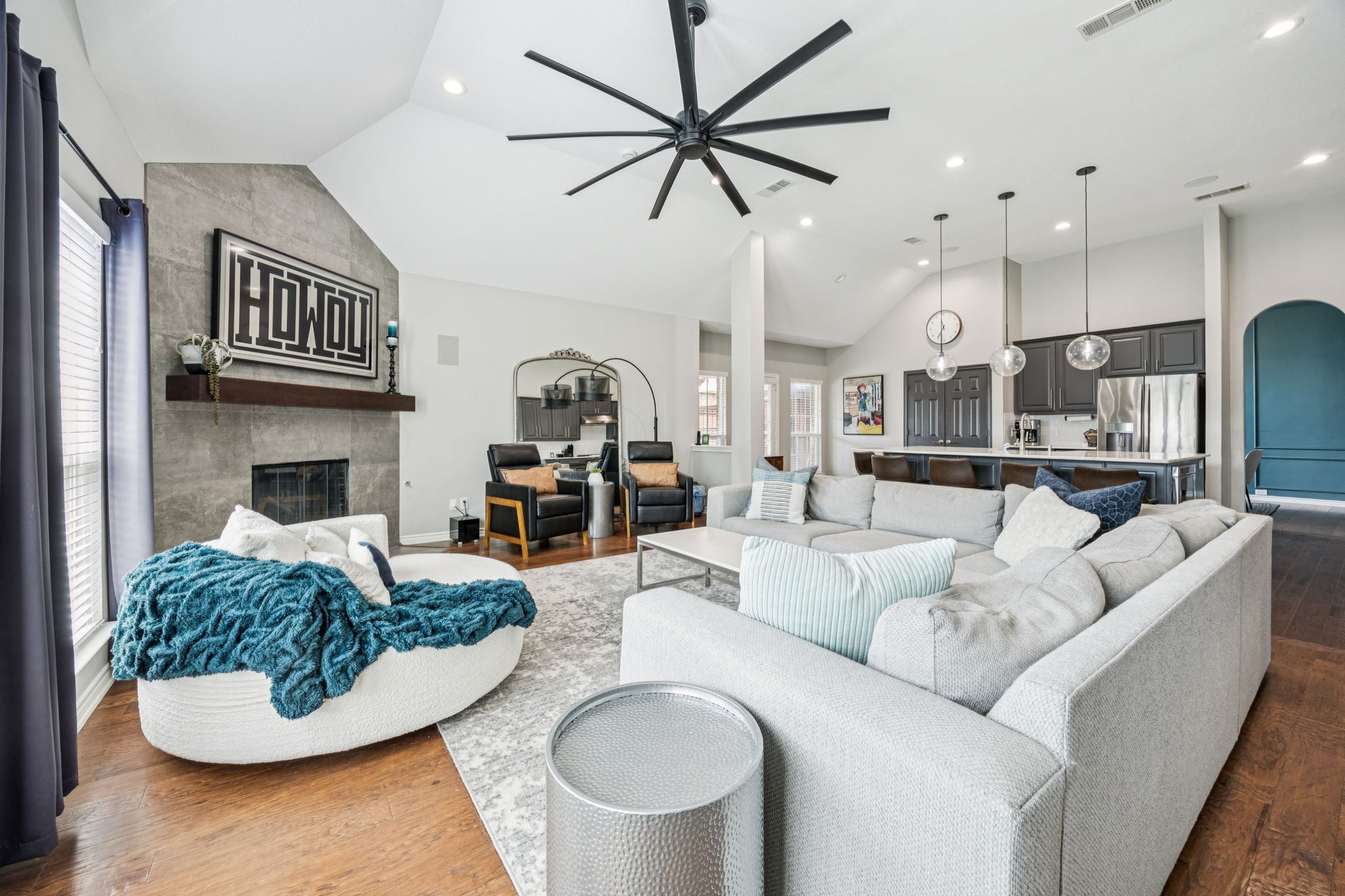 Spacious open-concept living with 15-ft ceilings and a cozy atmosphere.