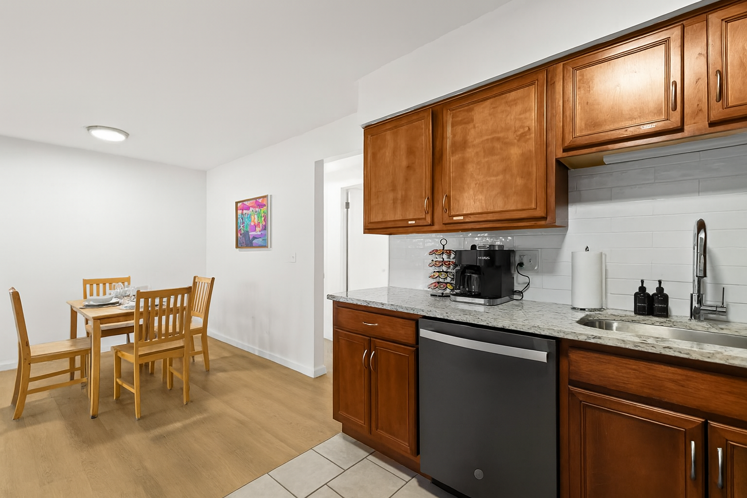 Warm wooden cabinets and modern finishes give this kitchen a welcoming, homey vibe.