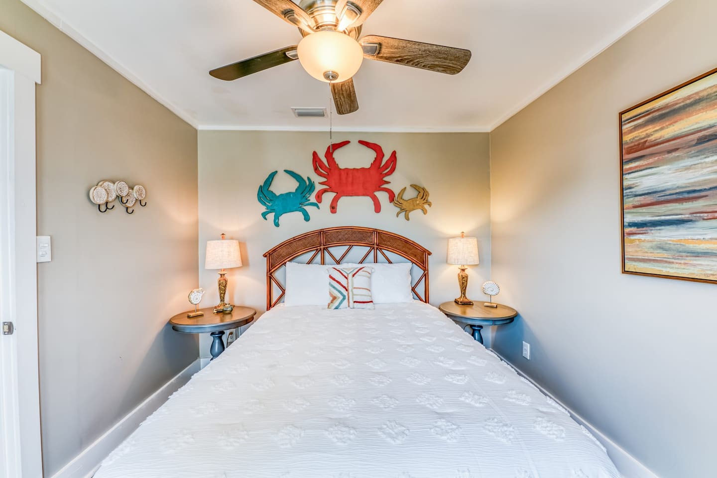Bedroom Retreat: Vibrant crab decor and soft lighting invite relaxation after beach adventures!