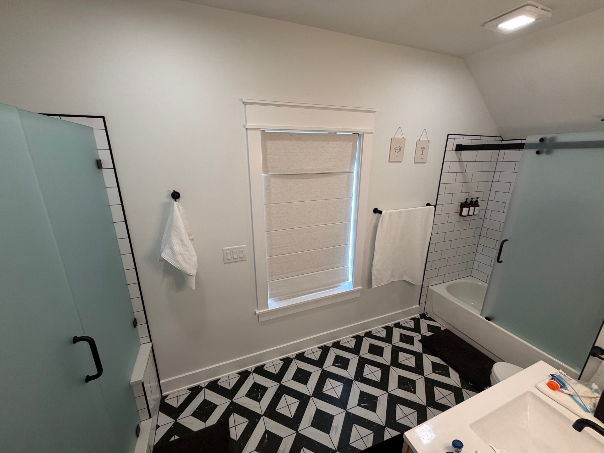 Upstairs bathroom with two showers