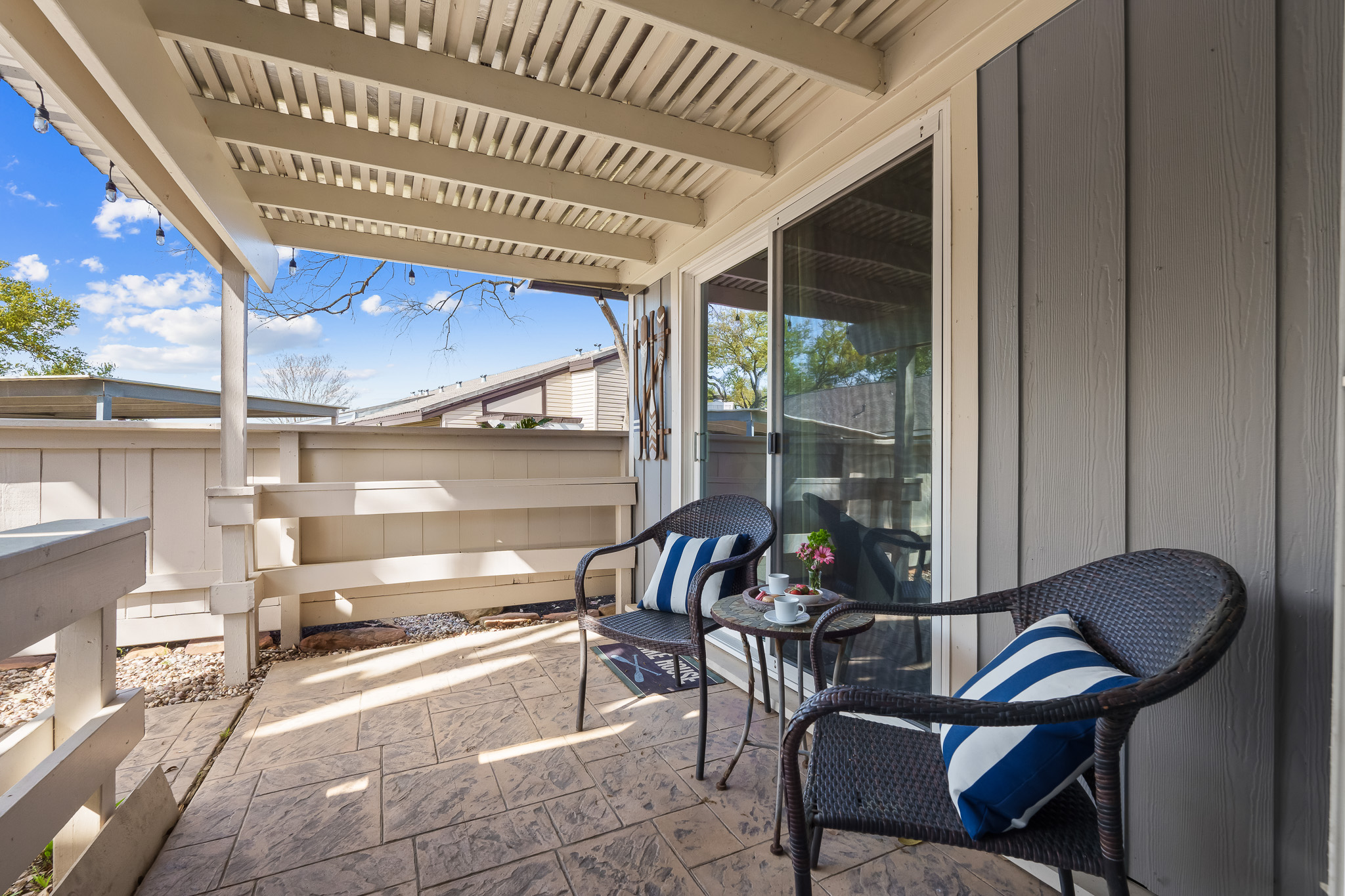 Step out from the master bedroom into this charming private courtyard—perfect for sipping your morning coffee or enjoying a quiet evening under the string lights. Cozy seating and a peaceful vibe make it your own little retreat.