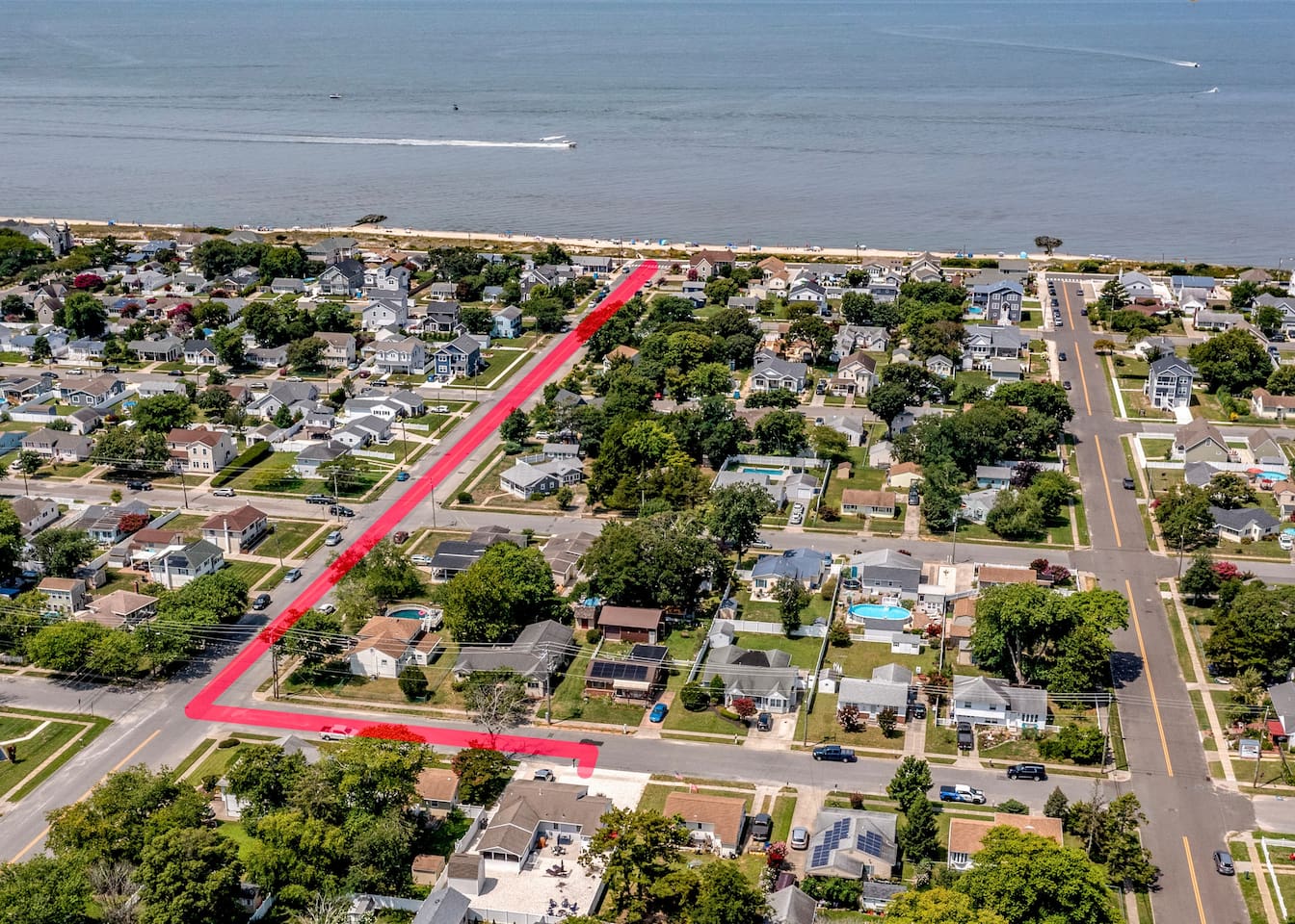 See how close you are to the shore! This aerial view highlights the quick, easy route from your front door to the beach. Enjoy the ultimate convenience of a short walk to the water whenever the ocean calls.