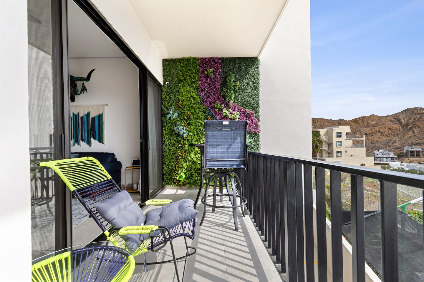 Discover the stunning nature wall on the balcony, accessible from the master bedroom or living room, featuring handcrafted art. This tranquil retreat enhances your Cabo getaway with natural beauty and relaxation.