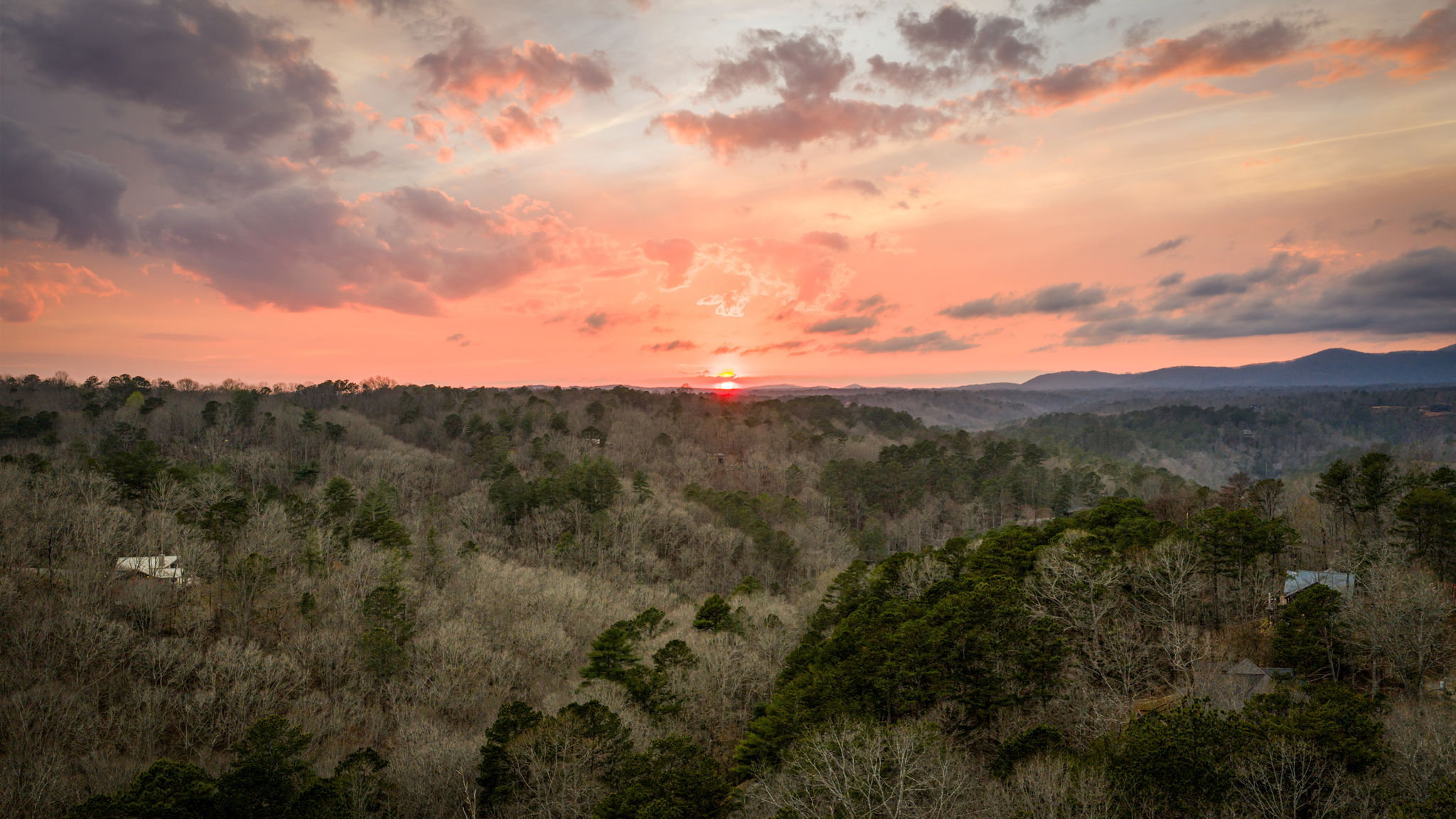 As the sun begins to set, warm golden hues fill the sky, enhancing the natural beauty of the scene.