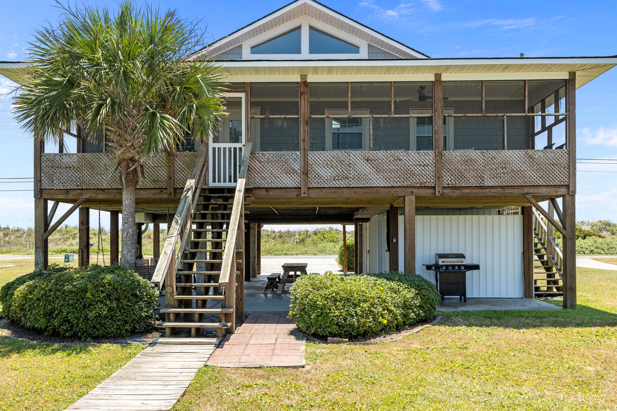 Indoor-outdoor living with a screened porch and plenty of yard space