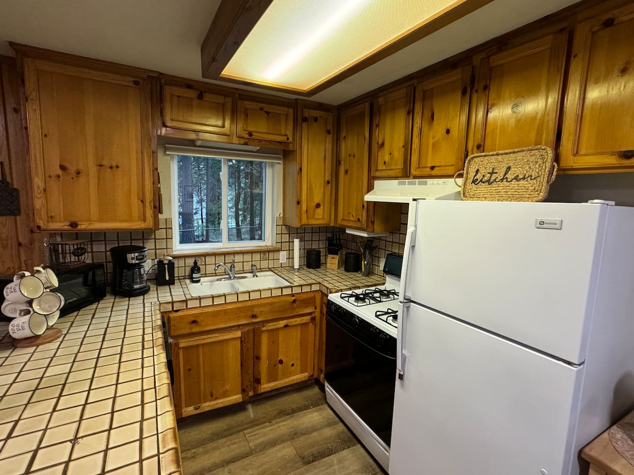 This kitchen is stocked by two home chefs. Help yourself to the spices, oils and pantry staples. 