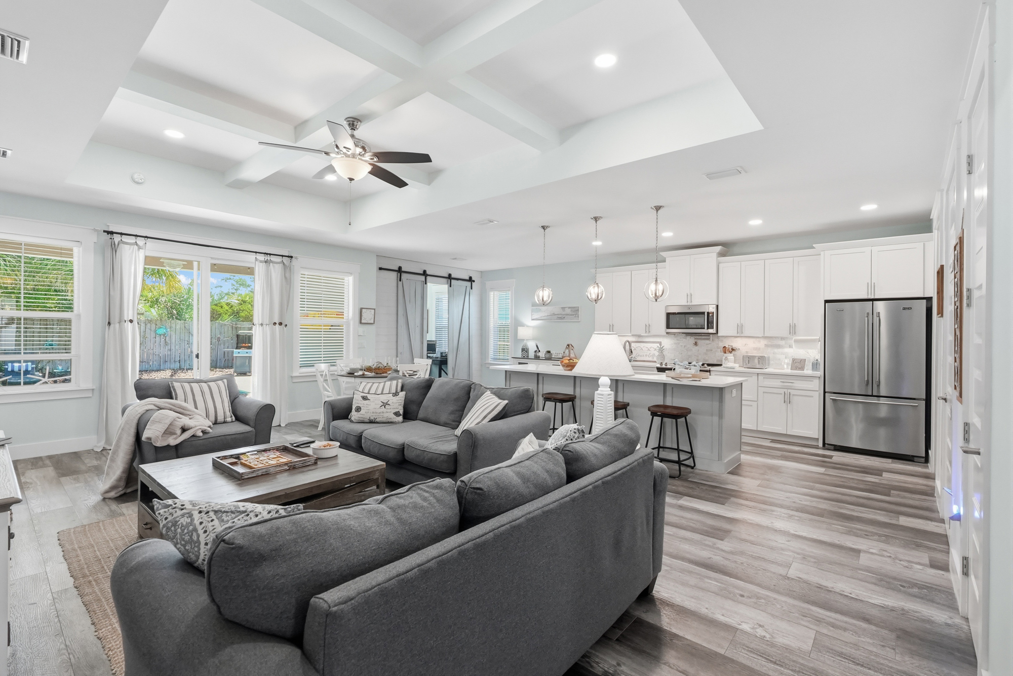 Make yourself comfortable at in the main living room, with open plan living, a beautiful vaulted ceiling, a huge island, large streaming TV, coffee table and tons of games