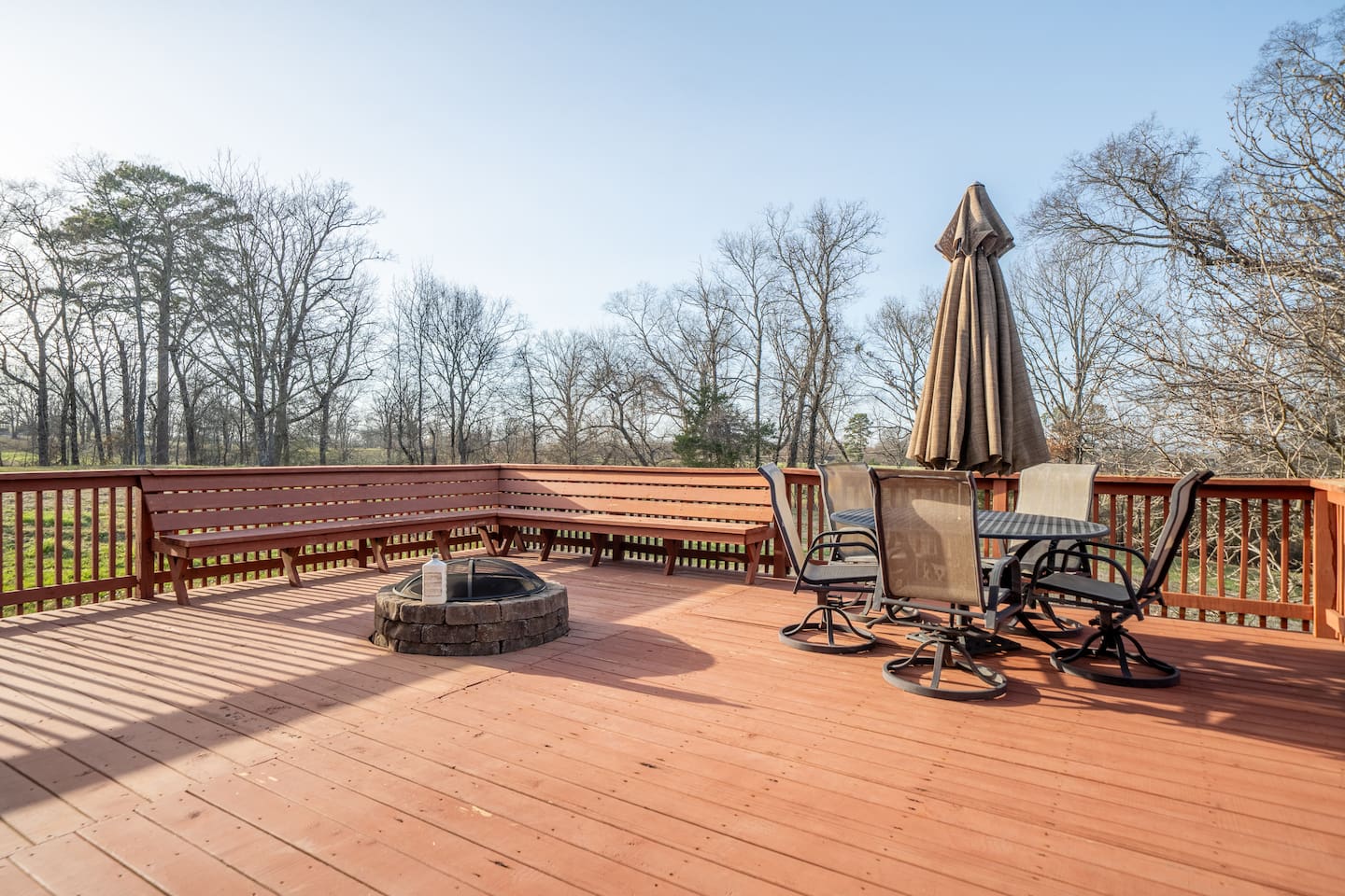 Outdoor Deck Retreat: Enjoy gatherings by the fire pit on this expansive deck with scenic views!