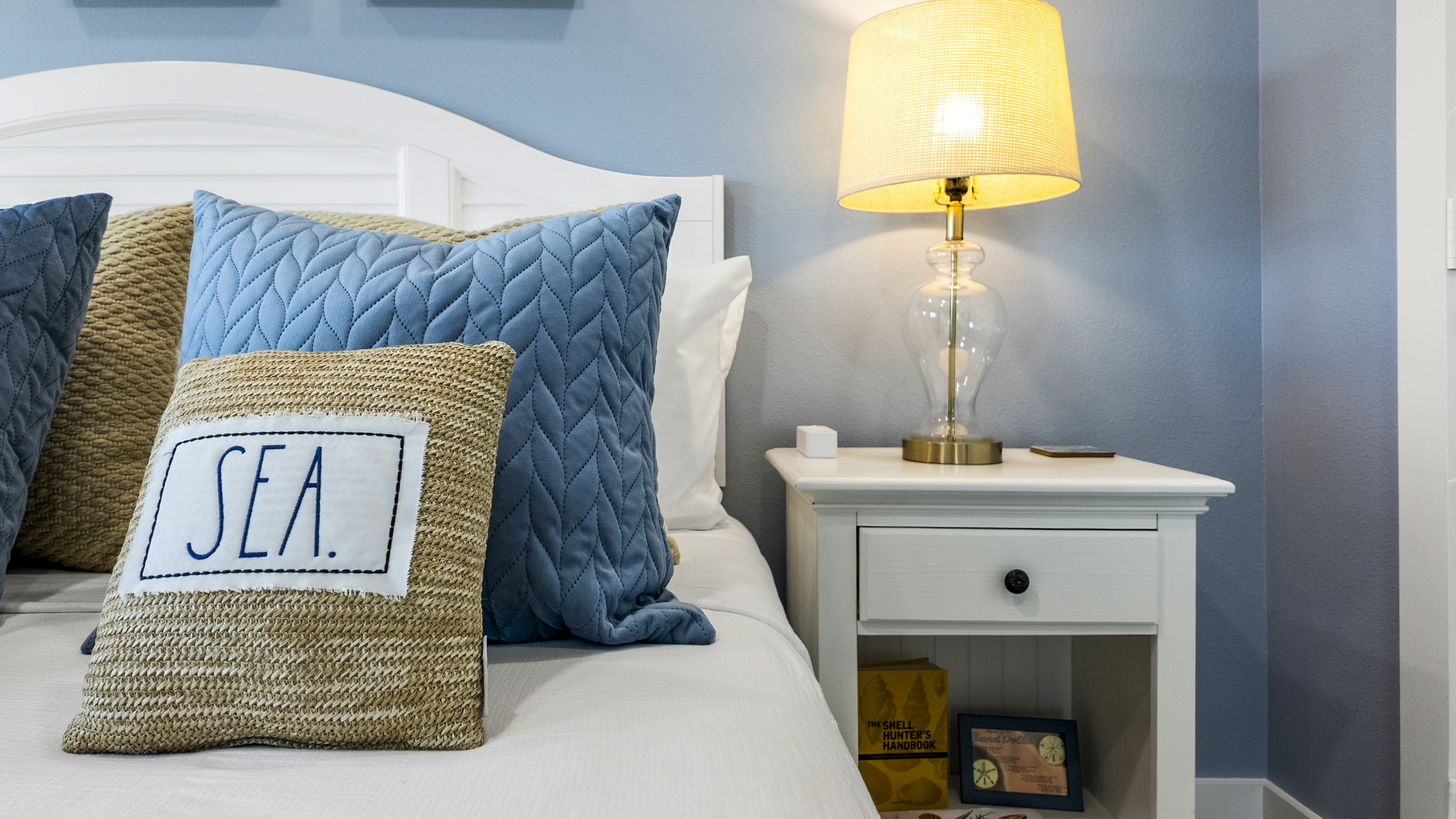 Lie in bed and enjoy the ocean waves AND the 50 inch tv in the Murdoch's Souvenir Shop themed Primary Suite.