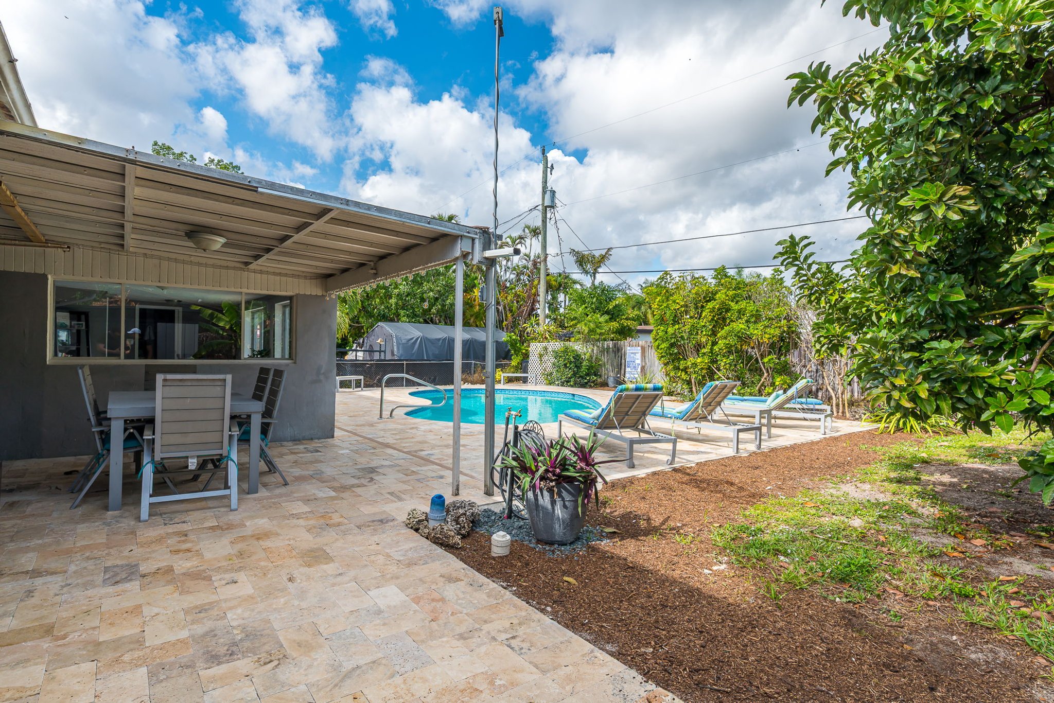 The outside is a highlight, with the heated pool, outdoor sun- loungers, BBQ and covered dining area.