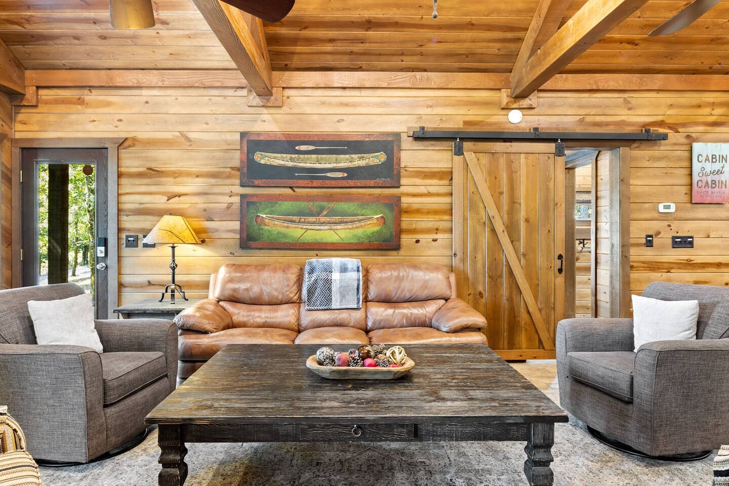 Spacious seating, Smart TV, and natural light make this the heart of the cabin.