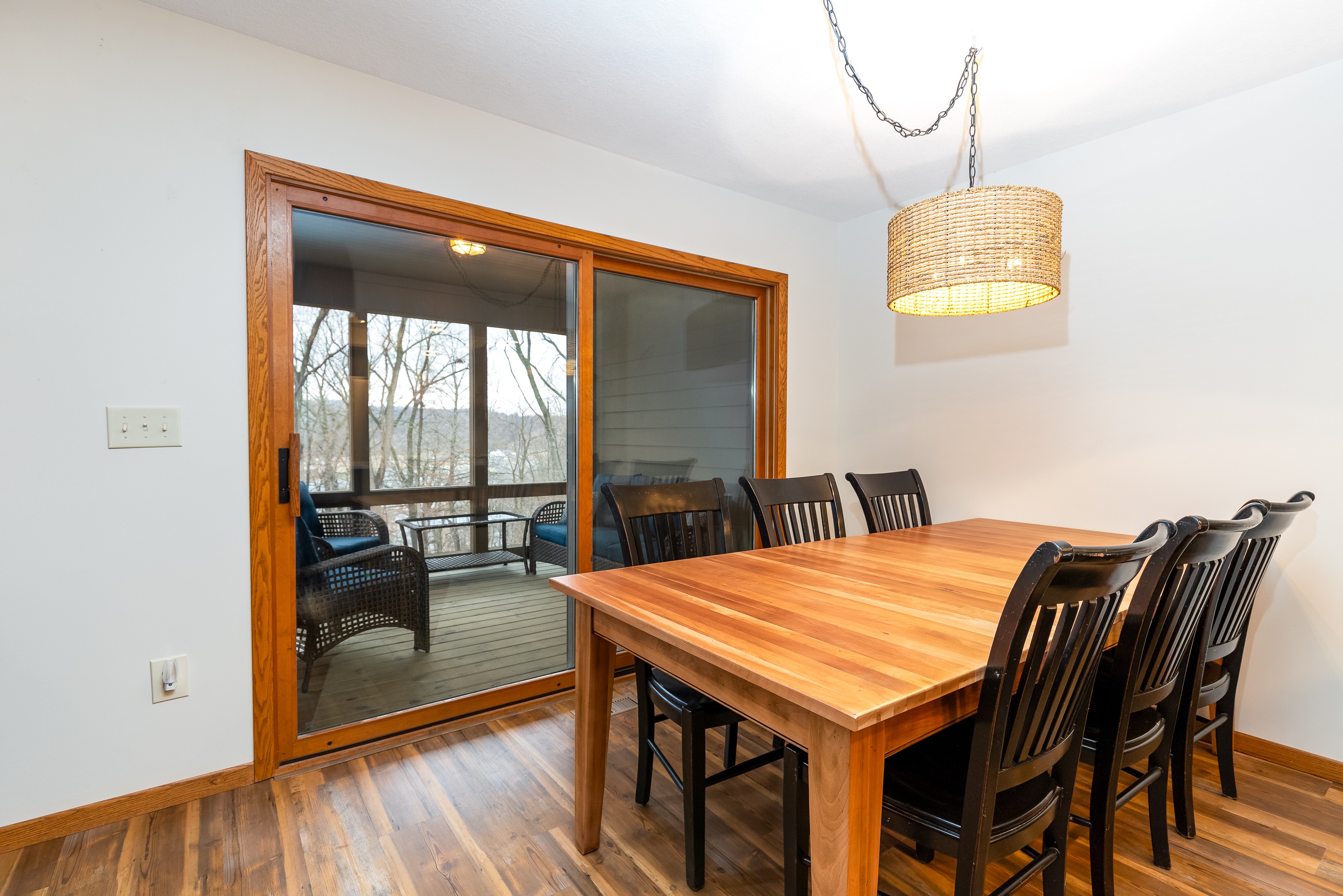 The dining table seats 6 with additional seating at the counter