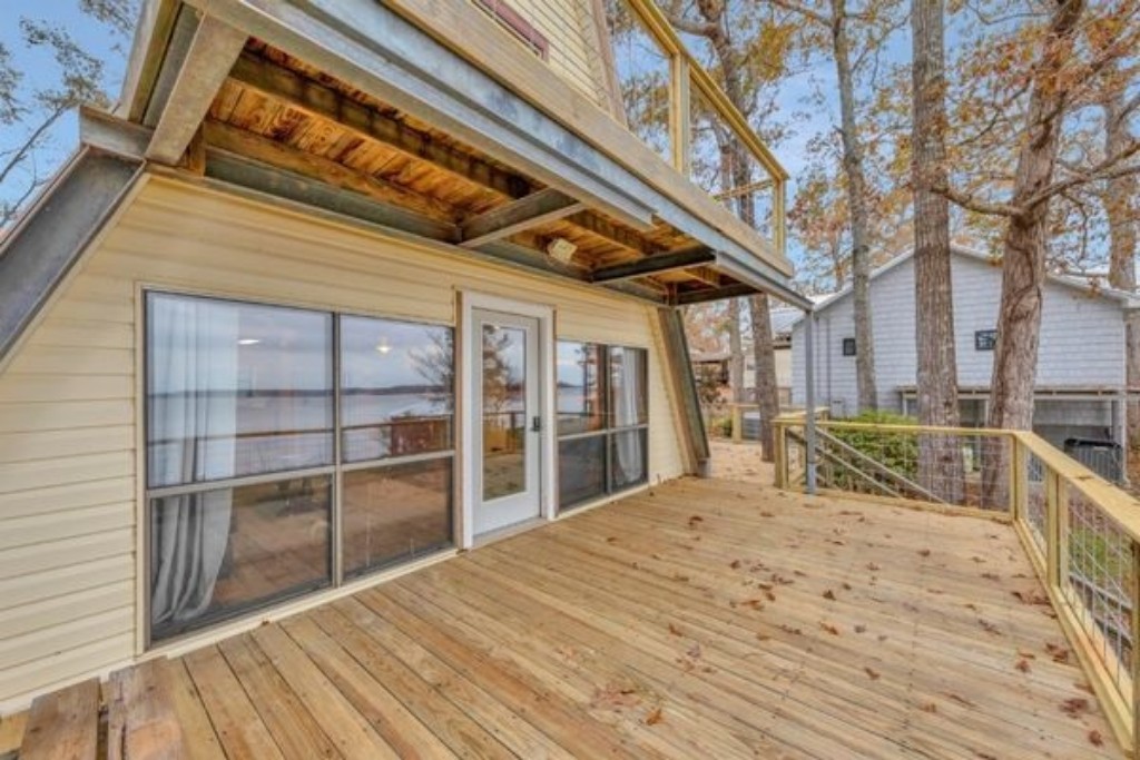 Step out onto the spacious outdoor deck overlooking Toledo Bend Lake, perfect for relaxing in the morning with a cup of coffee or unwinding while watching the beautiful sunrise and sunset. Enjoy peaceful moments surrounded by stunning natural views. 