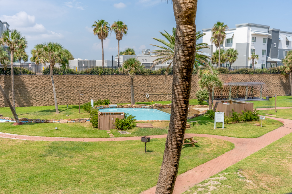 Large balcony with views of two of the 3 pools