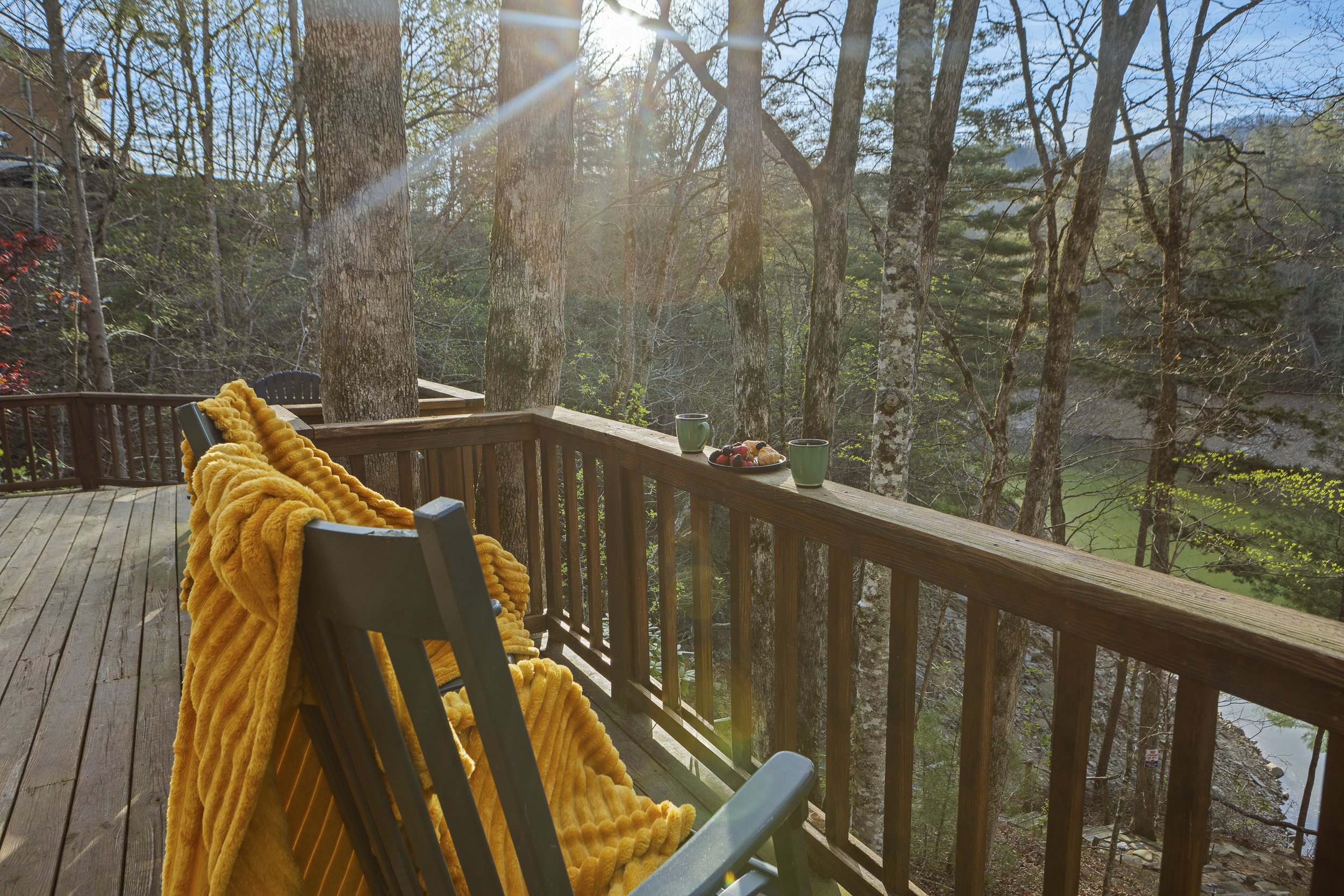 Deck: Relax with stunning views, morning coffee, and a vibrant blanket under the sun!