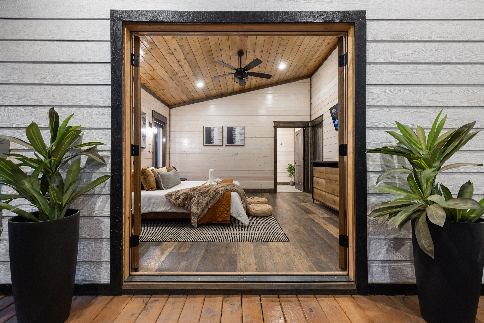 Your king suite opens through double doors straight to the covered deck and hot tub, making late night soaks and slow mornings in the pines just steps from bed.