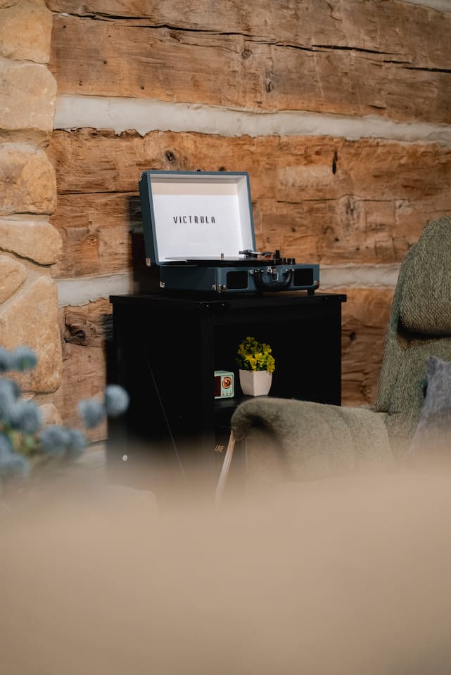 Relax with the timeless sounds of vinyl from the Victrola record player.