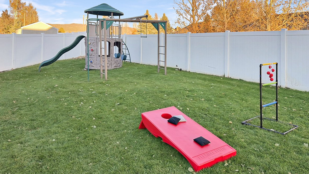 Send the kids out back to burn off some energy on the Playset, Bags and Ladder Golf!