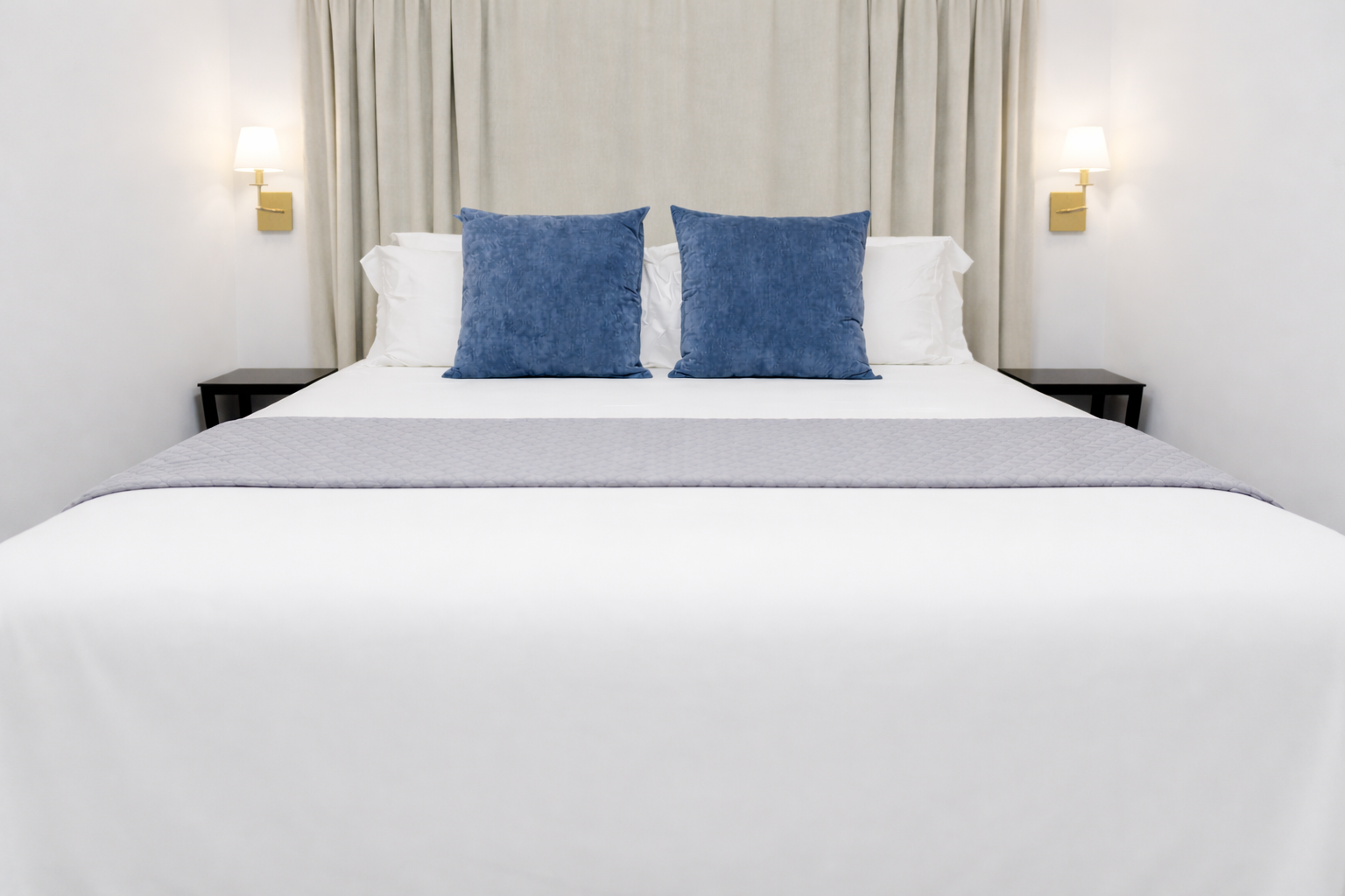 Cozy bed with plush pillows & layered linens