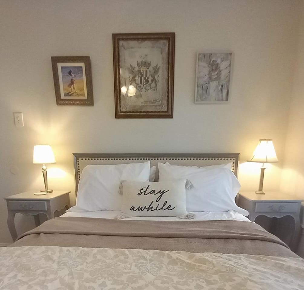 This second bedroom features comfy queen sleeping, closet storage and a chest of drawers.