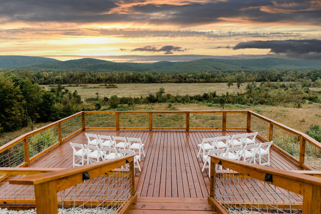 Outdoor reception setup with valley views from the deck.