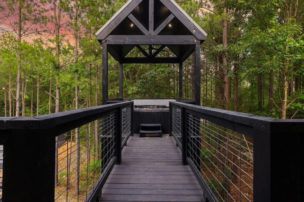 Hot Tub Deck: Unwind under the stars on this stylish deck, surrounded by serene woodland vibes!