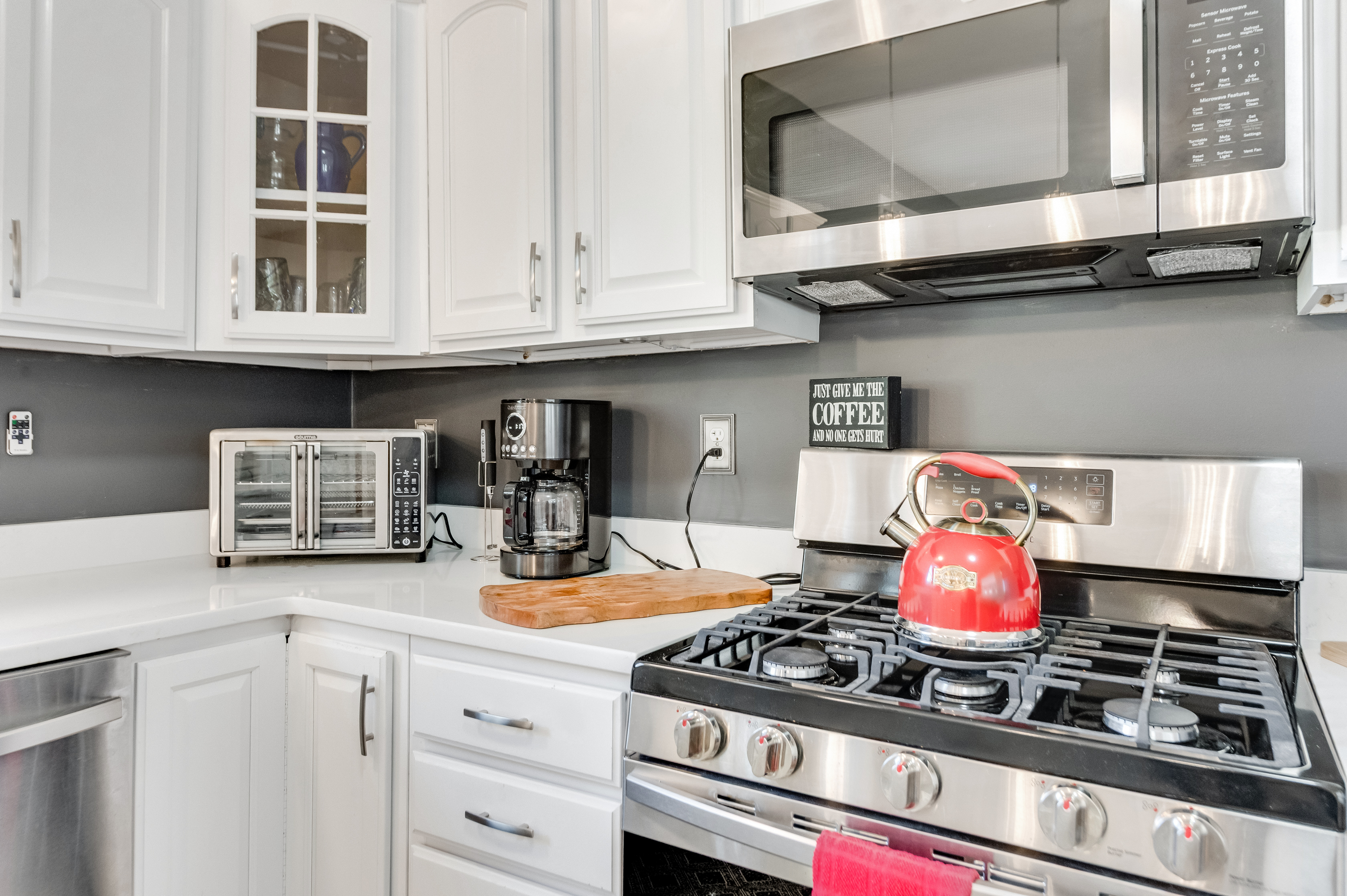 Kitchen: Modern appliances and bright decor invite culinary creativity and delightful gatherings!