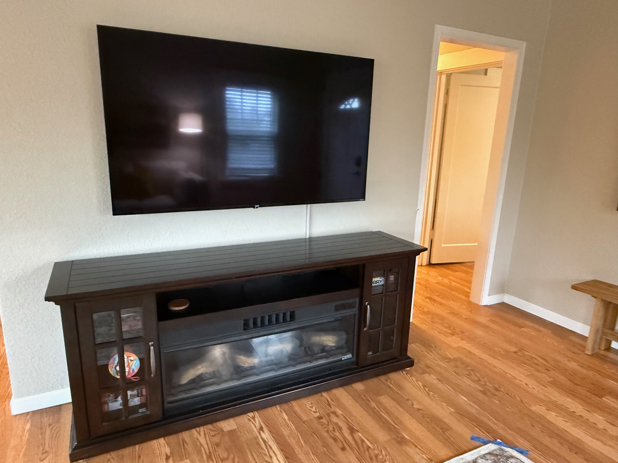 Large living room TV with electric fireplace