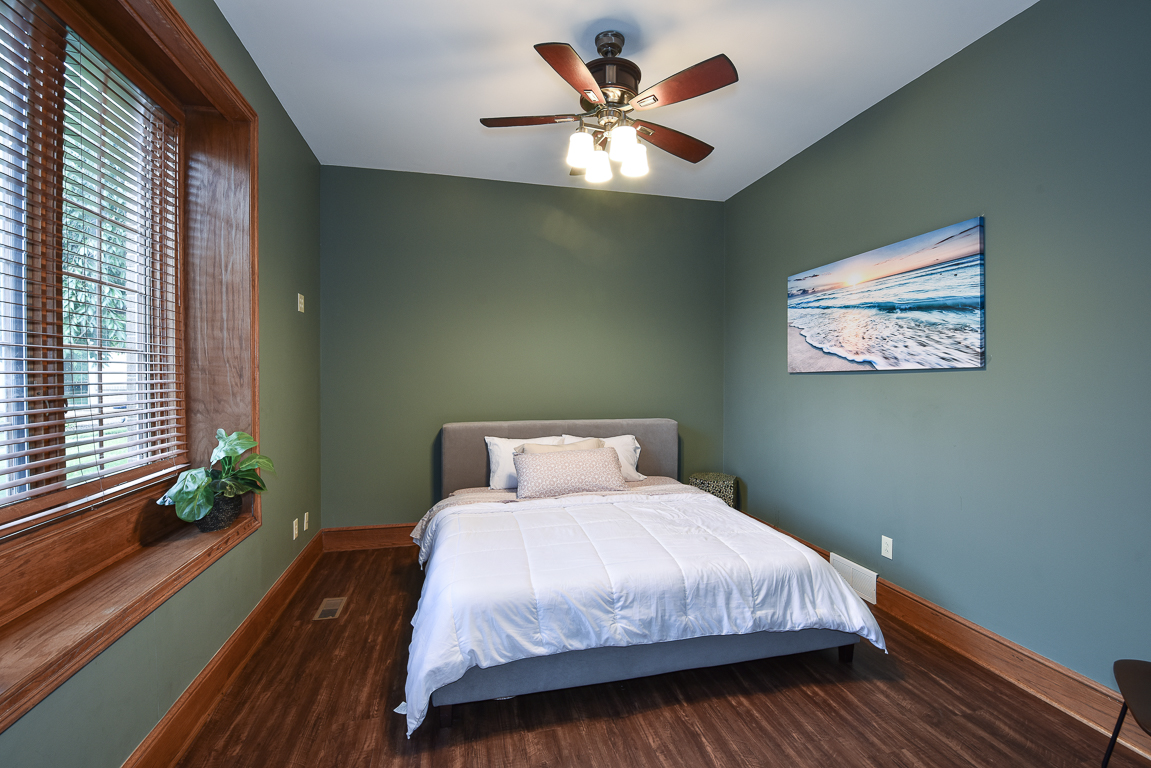 Downstairs guest room with queen-size bed.