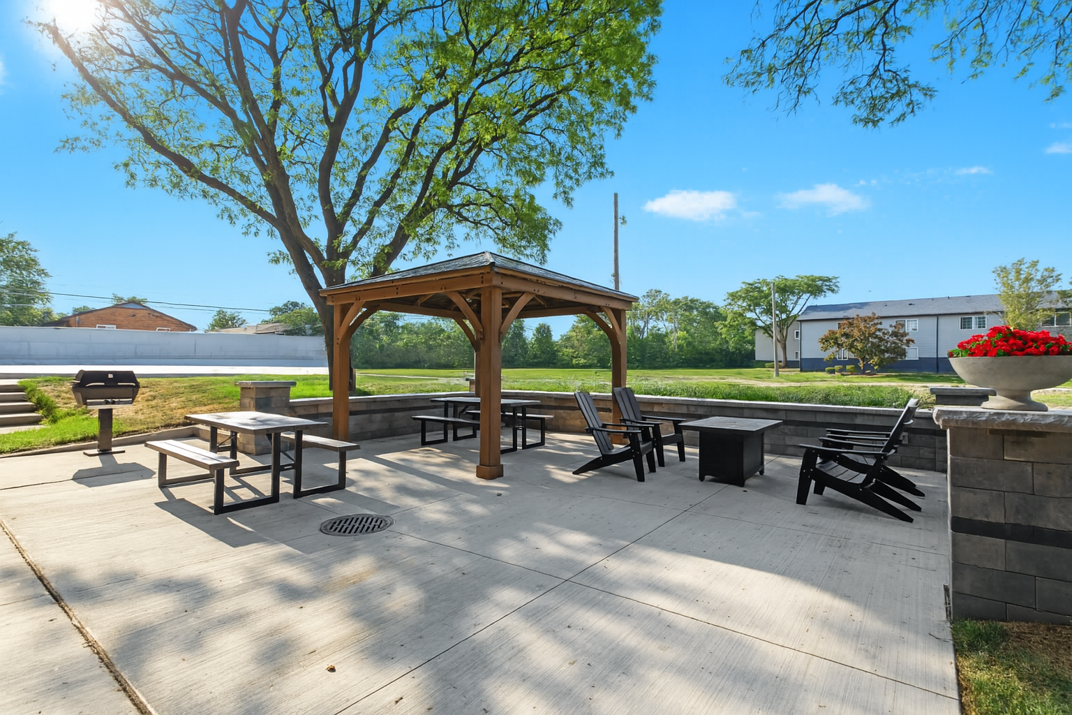 Make the most of sunny days in this comfortable outdoor dining and grilling space.